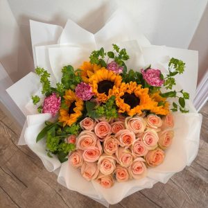 Beauty Queen floral arrangement with 50 roses, five sunflowers, and five carnations