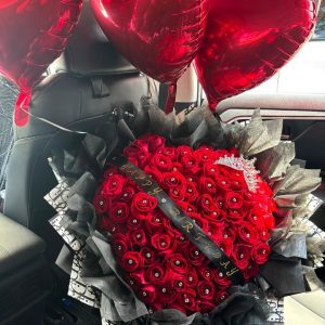 My Heart Is Yours heart-shaped arrangement with 100 roses, a decorative crown, and a custom ribbon