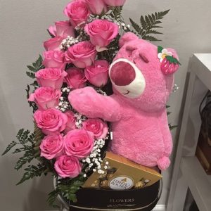 Sweetheart Snuggles arrangement with 25 roses, a box of chocolates, and a sleeping teddy bear