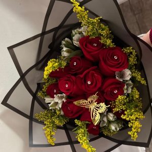 Diamond Bouquet of 12 red roses with decorative gems, white alstroemeria, yellow solidago, and a gold butterfly decoration.